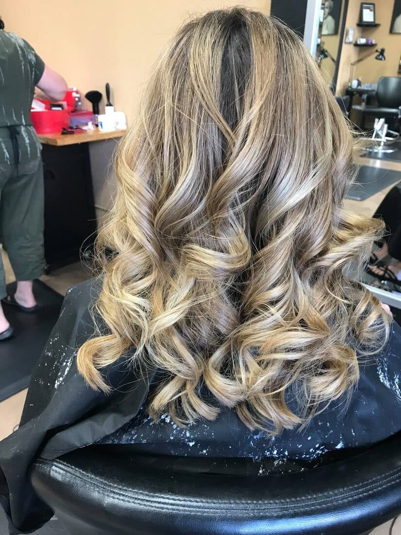 Long wavy blonde and brunette dimensional highlights