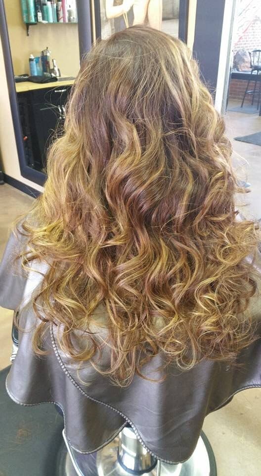 Long caramel curls with golden highlights
