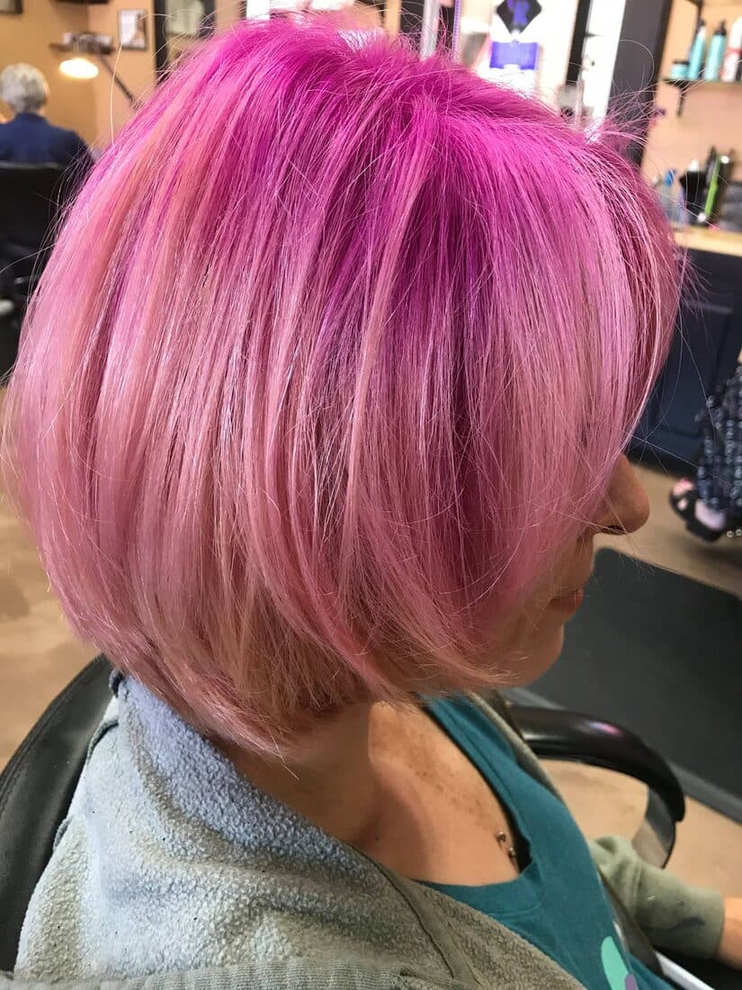 Shoulder-length pink bob styled in salon